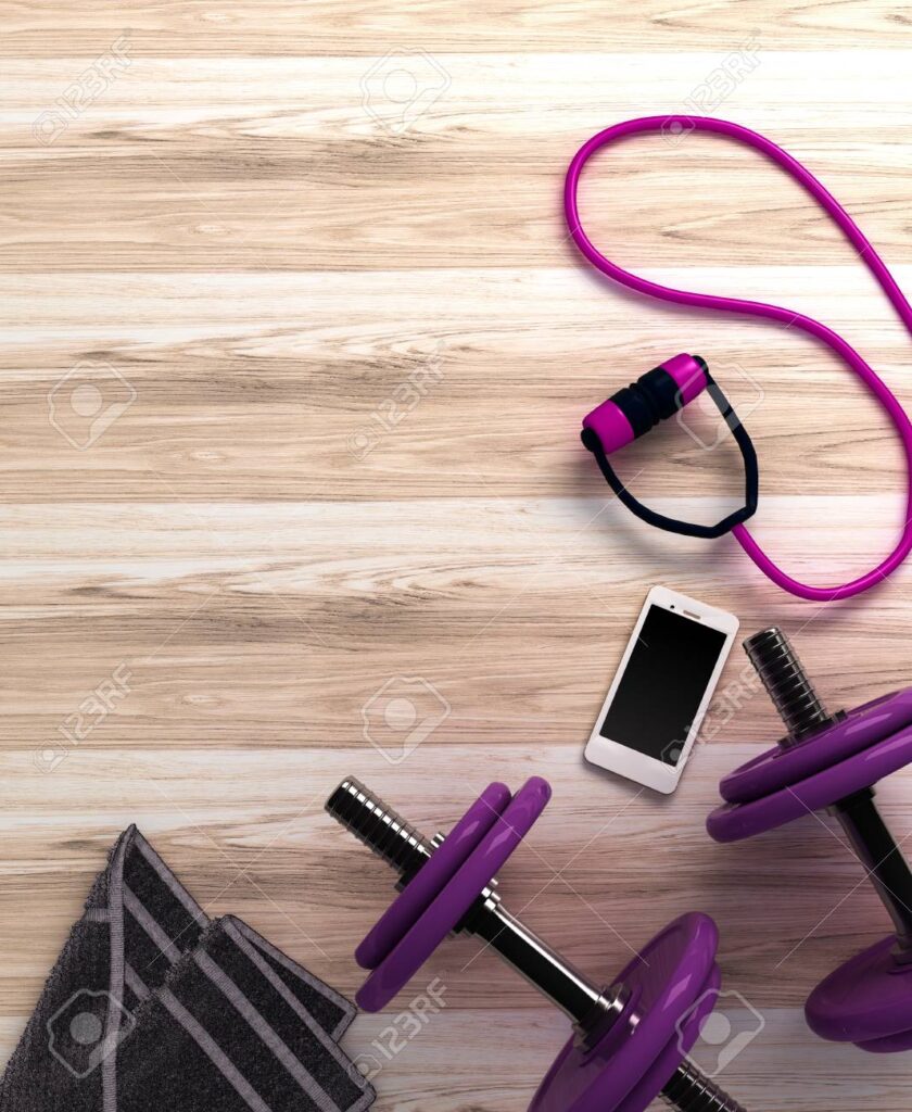 Fitness background with dumbbells and smartphone. View from above